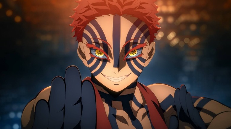 Akaza grinning in a fight pose in Demon Slayer: Kimetsu no Yaiba — Infinity Castle