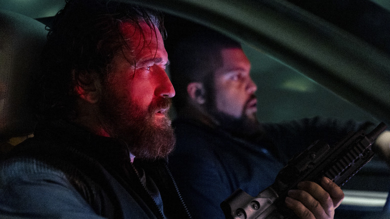 Big Nick and Donnie sit in a car in Den of Thieves 2: Pantera