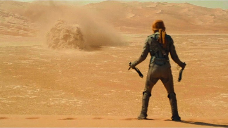 Paul prepares to jump on an approaching worm in Dune: Part Two