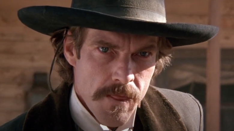 Dennis Quaid looks wan and angry as Doc Holliday in Wyatt Earp