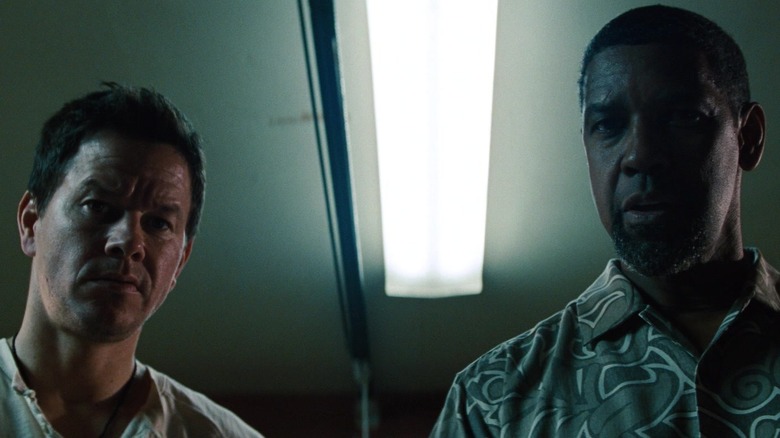 Stig and Bobby Beans in a dark room in 2 Guns