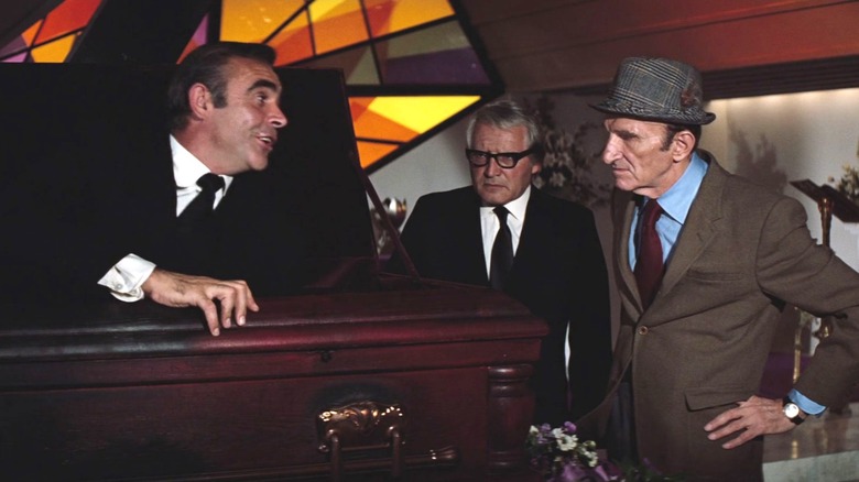 Bond sitting coffin surprised men Diamonds Forever
