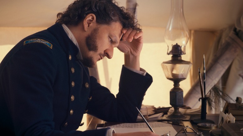 Colonel Higginson pores over document