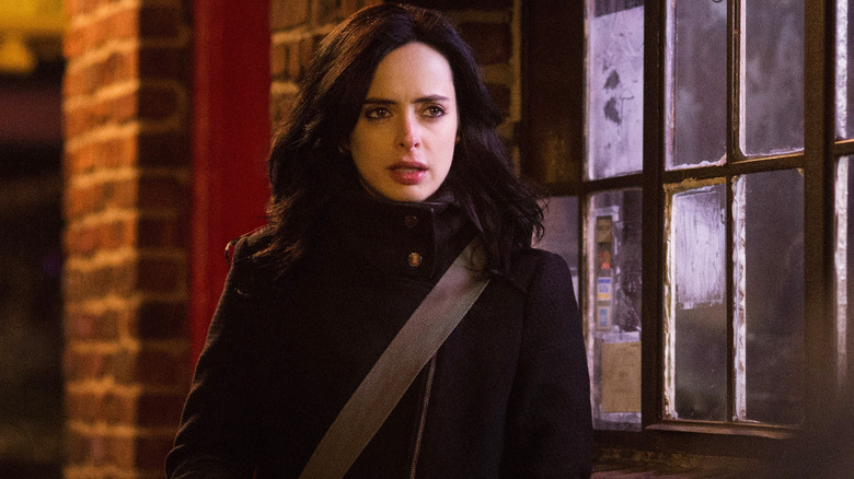 Krysten Ritter looking concerned as Jessica Jones