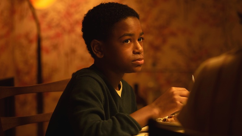 Will Hanlon sitting at the table with his family in It: Welcome to Derry