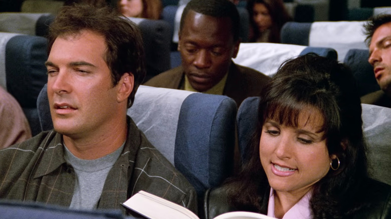 David Putty and Elaine Benes sitting in a plane in Seinfeld