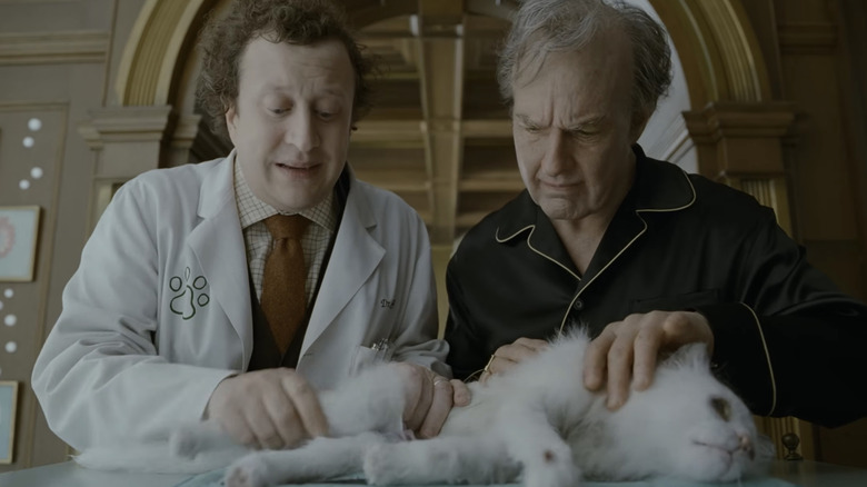 A vet and Digger Rockwell examine Digger's beloved cat in Digger
