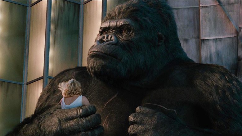 King Kong sitting on a building with Ann Darrow in his hand in King Kong (2005)