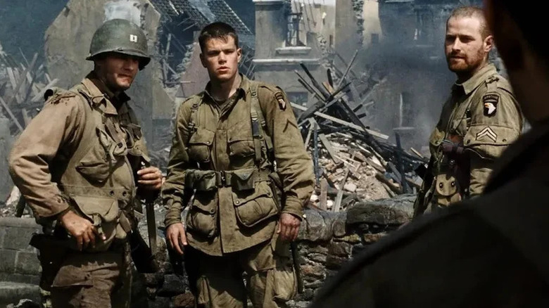 Captain John Miller, Private Ryan, and another soldier looking at someone in Saving Private Ryan