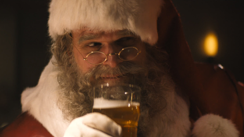 Violent Night santa having a drink
