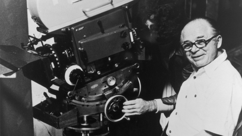 Billy Wilder smiles with Panavision camera on set