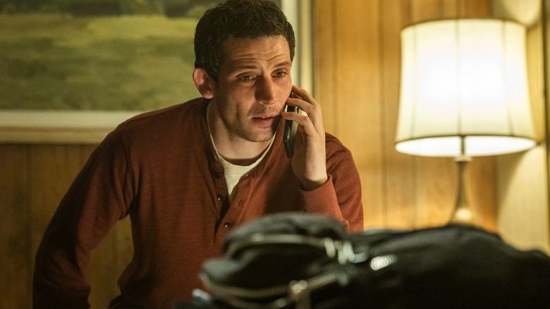 Josh O'Connor as Daniel on the phone with red eyes in Disclosure Day