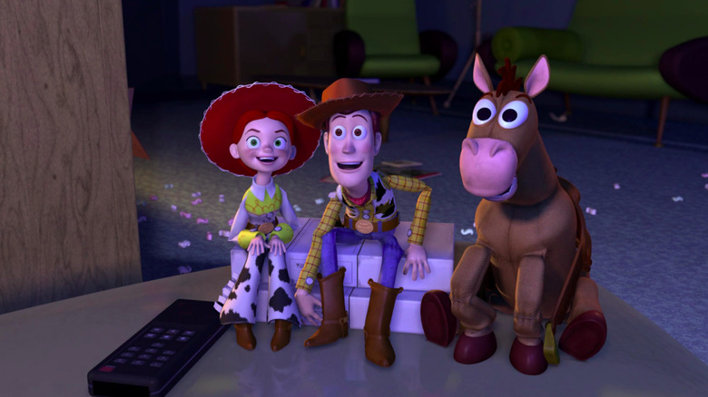 Jesse, Woody, and Bullseye watch TV