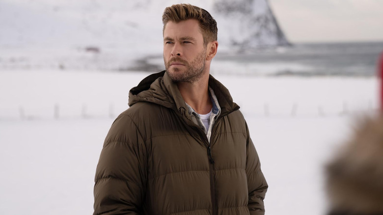 Chris Hemsworth staring off into the distance in Limitless with Chris Hemsworth