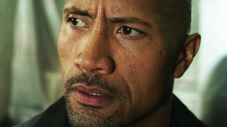 Dwayne Johnson's John Matthews looks across frame in Snitch