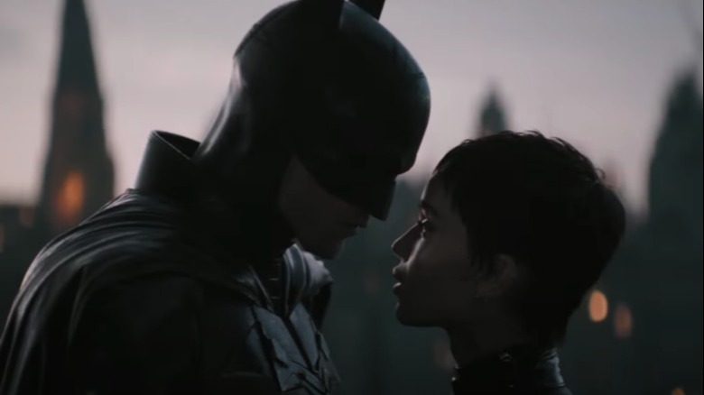 Batman stands close to catwoman