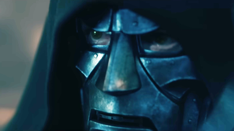 Robert Downey Jr. as Doctor Doom with his mask illuminated by lightning in Avengers: Doomsday