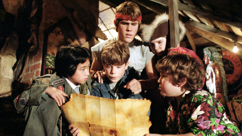 The Goonies looking at One-Eyed Willy's map