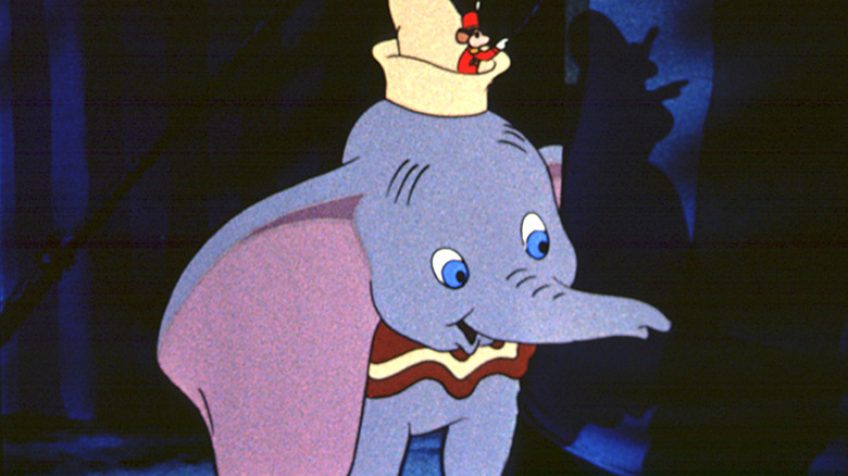 Timothy Q. Mouse standing on Jumbo Jr's hat in 