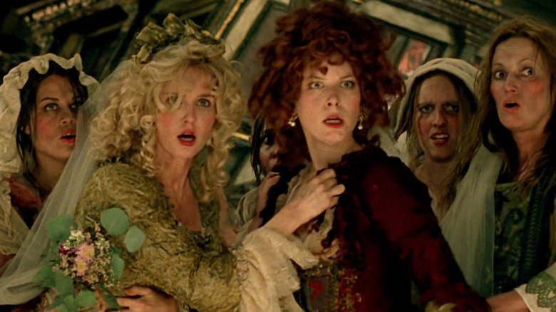 Scarlett and Giselle surrpounded by hopeful brides in Pirates of the Caribbean: Tales of the Code: Wedlocked