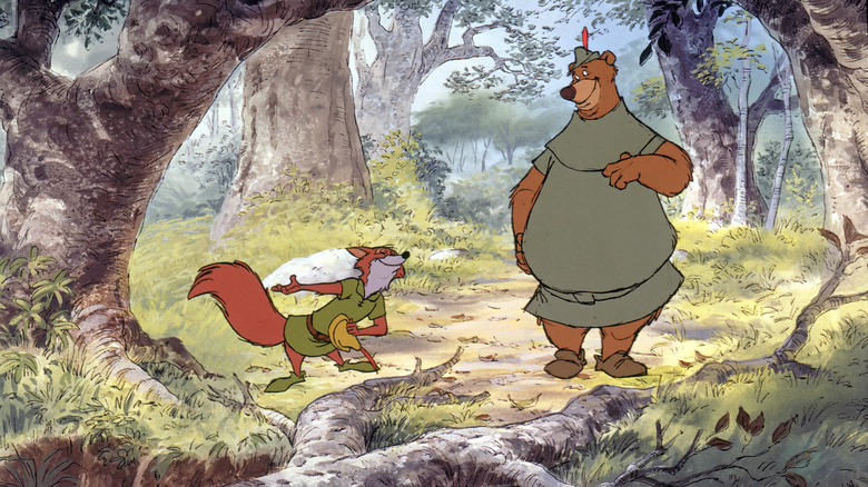 Robin Hood and Little John walking through the forest.