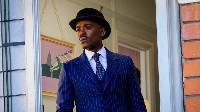Ncuti Gatwa as the Doctor wearing a suit and a bowler hat on Doctor Who