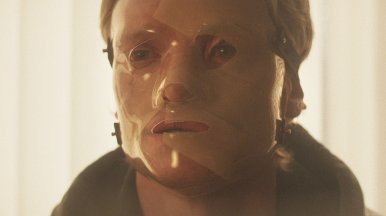 Tom Rhys Harries as Matt Hagen with bandages all over his face in Clayface