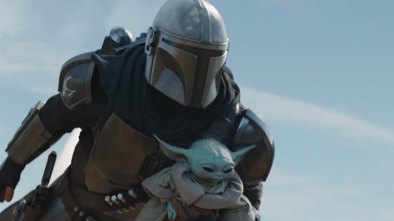 Pedro Pascal and Grogu in The Mandalorian