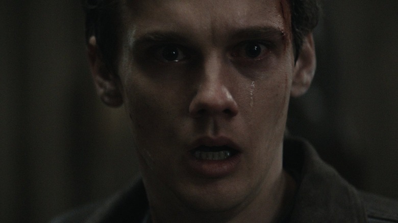 Hunter Doohan as Joseph with a tear streaming down his face in Evil Dead Burn
