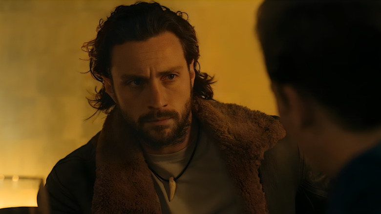 Aaron Taylor-Johnson as Kraven looking stern in Kraven the Hunter