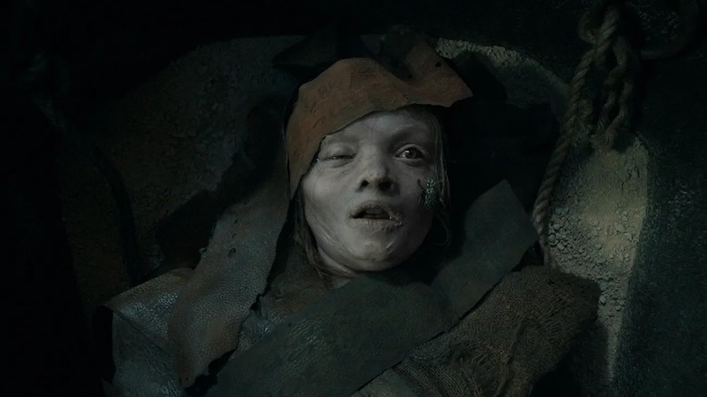 Katie laying in her coffin pale and covered in bandages in Lee Cronin's The Mummy