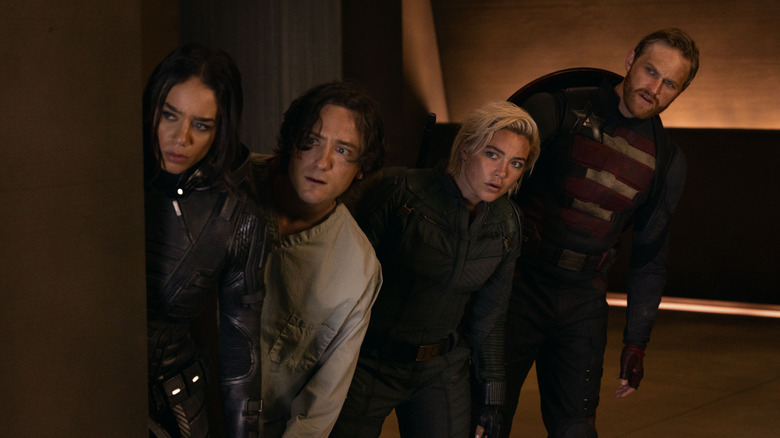 Ghost, Bob, Yelena, and Walker peeking around a corner in Thunderbolts