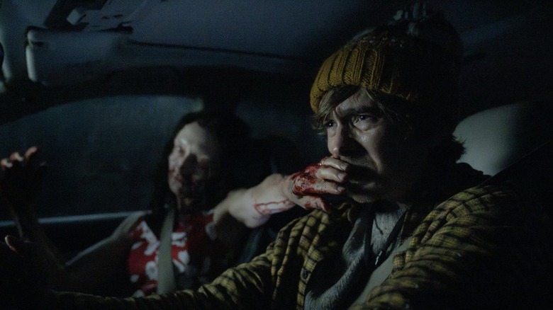 A zombie covering Bryan's (Austin Abrams) mouth in Resident Evil (2026)