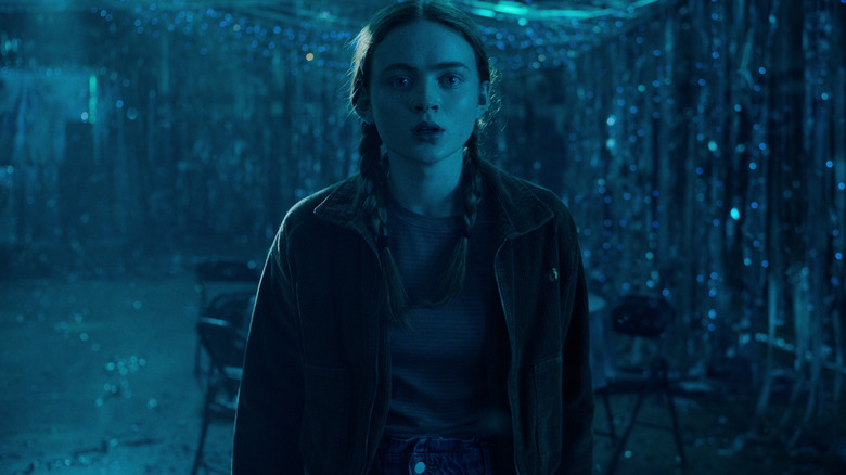 Max in an Upside Down version of the Snow Ball in Stranger Things