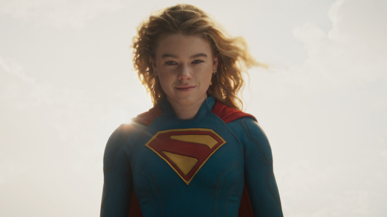 Milly Alcock as Supergirl smiling in the air in Supergirl (2026)
