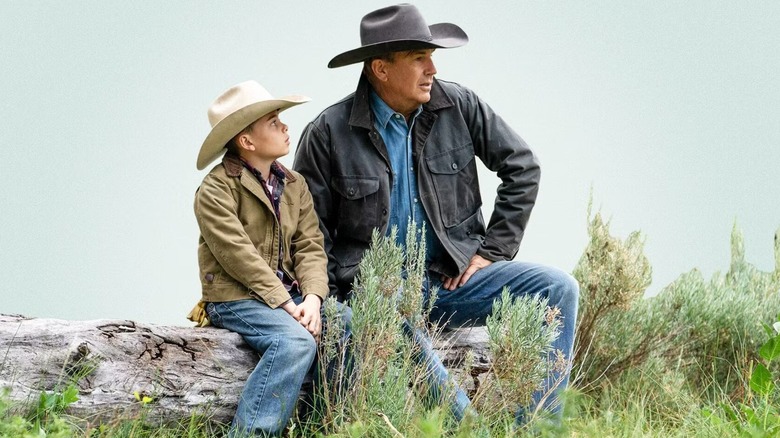 Tate Dutton sits next to John Dutton in Yellowstone