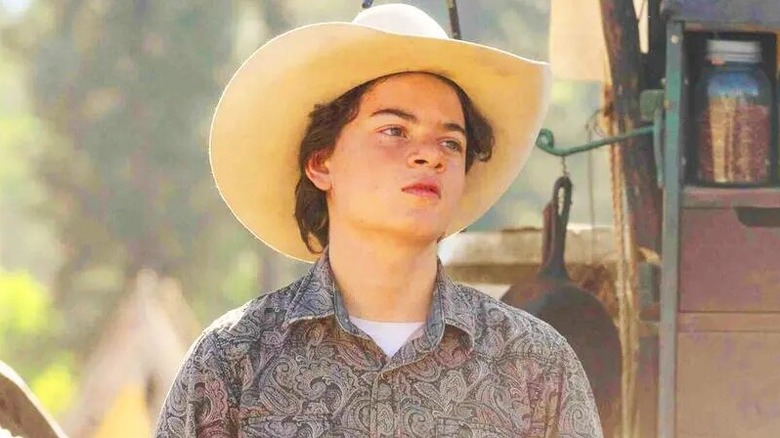 An adult Tate Dutton wearing a cowboy hat in Yellowstone