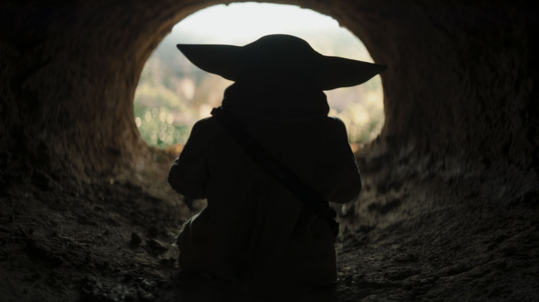 Grogu walking out of a cave in The Mandalorian and Grogu