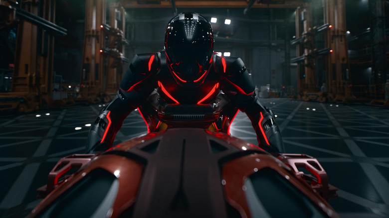 An A.I. soldier getting ready to ride a Light Cycle in Tron: Ares