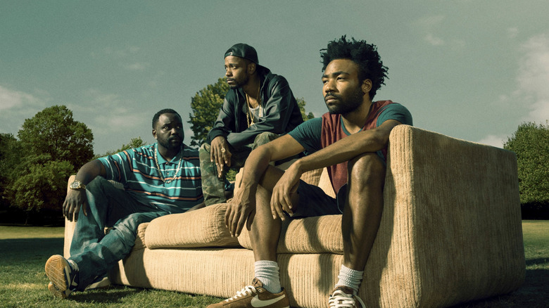 Brian Tyree Henry as Al, LaKeith Stanfield as Darius, and Donald Glover as Earn sitting on a couch in Atlanta