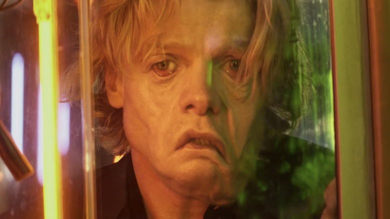 Tom Rhys Harries as Matt Hagen has got a face-melting famiyl as he gazes through a window in Clayface