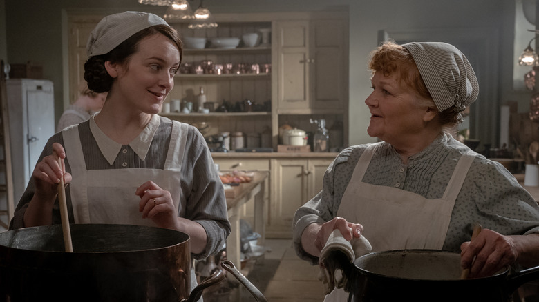 Sophie McShera and Lesley Nicol looking at one another in Downton Abbey: A New Era 