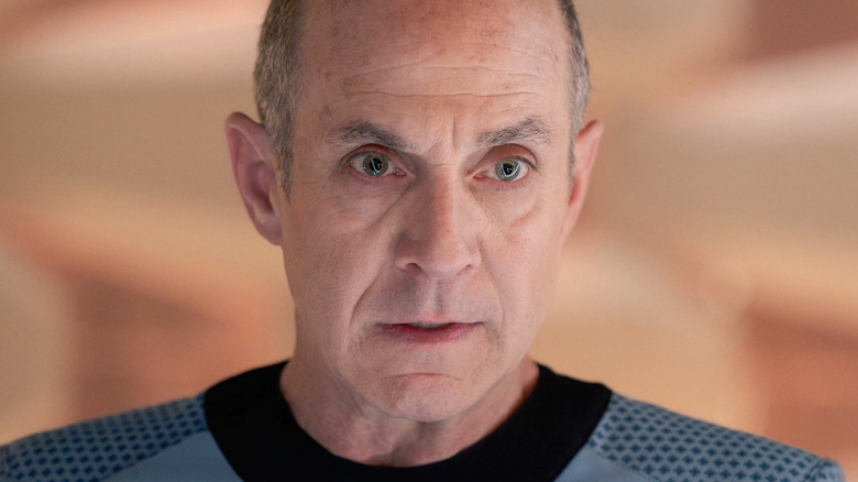 Brian Markinson as Dr. Boyce wearing a blue uniform in Star Trek: Strange New Worlds