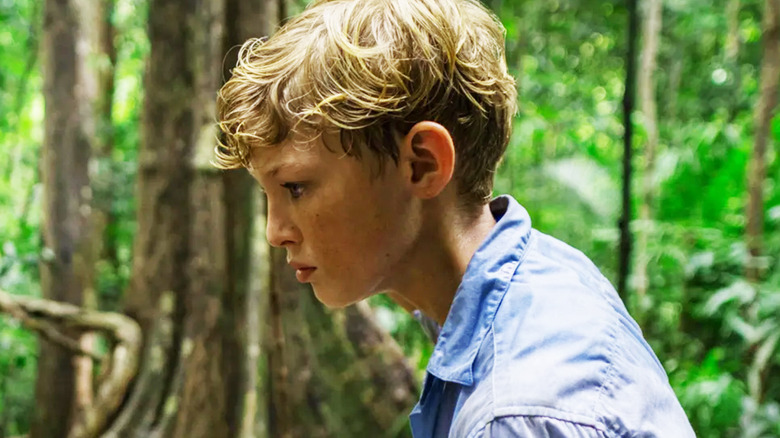 Lox Pratt's Jack is seen in profile standing in the forest in Lord of the Flies