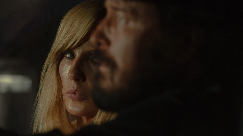 A crying Beth (Kelly Reilly) looking at Rip (Cole Hauser) on "Dutton Ranch."