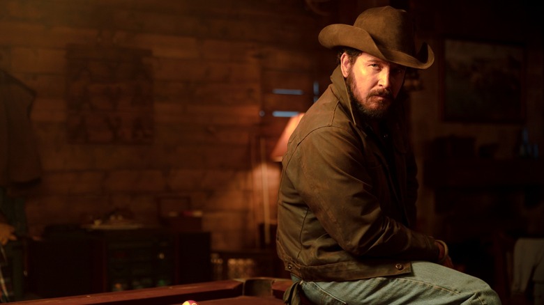 Cole Hauser's Rip Wheeler looks upset in a medium shot in Dutton Ranch