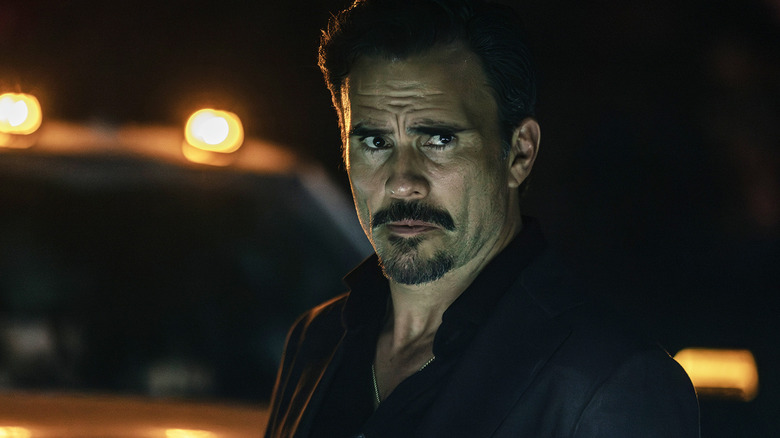 Juan Pablo Raba's Joaquin Reyes stands in front of a truck at night in Dutton Ranch