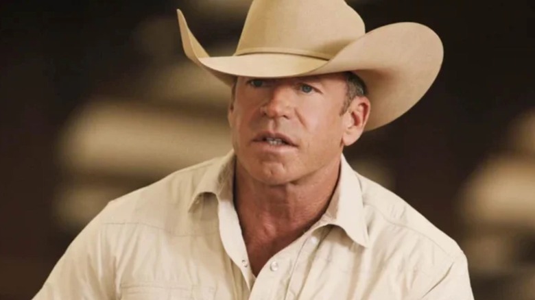 Taylor Sheridan in a white shirt and cowboy hat