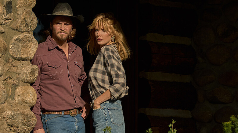 Luke Grimes' Kacey Dutton stands beside Kelly Reilly's Beth Dutton in Yellowstone