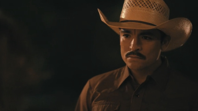Bobby Soto's Mariano Reyes stands in the dark looking across frame in Dutton Ranch